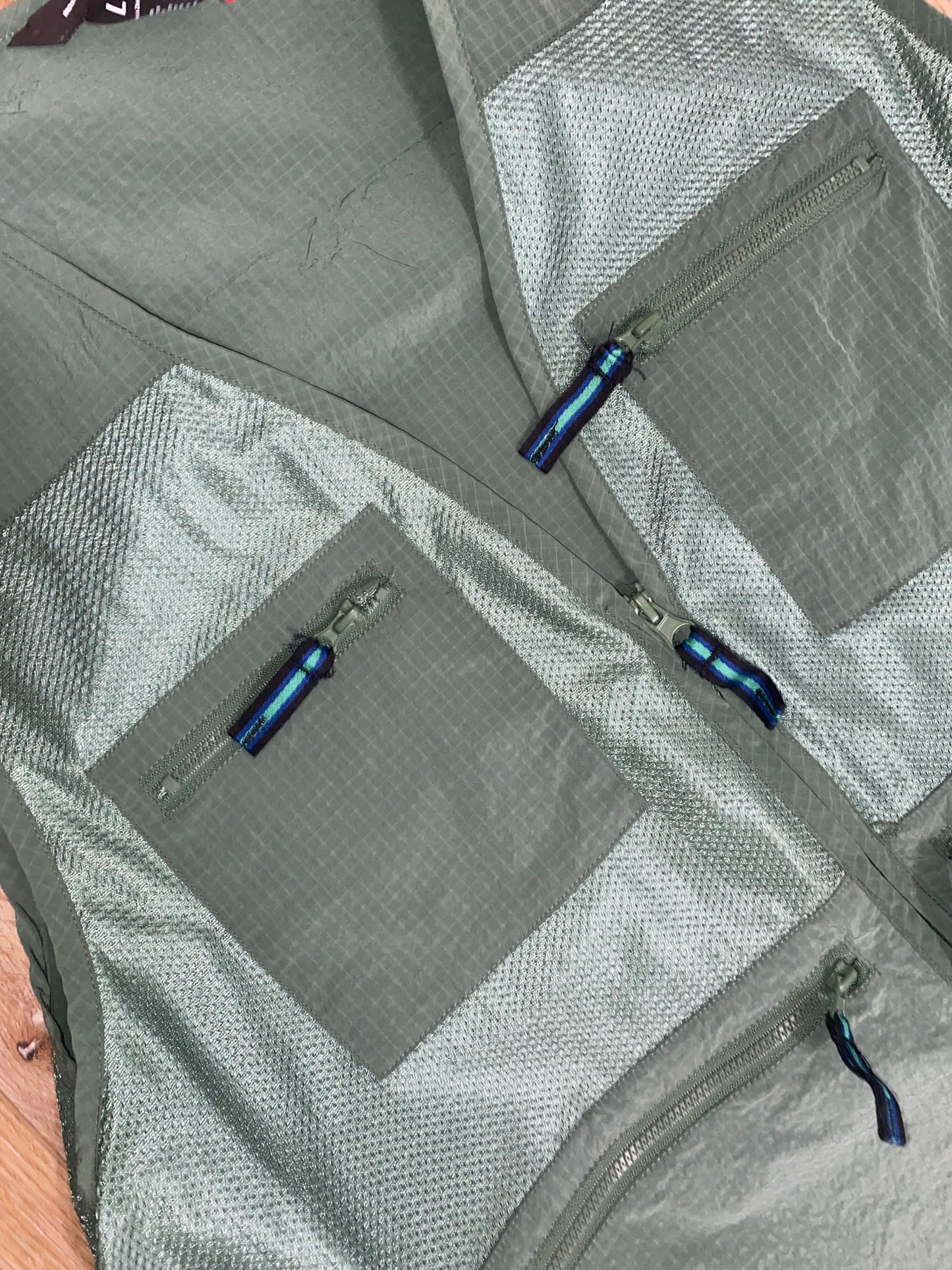 Green fisher vest